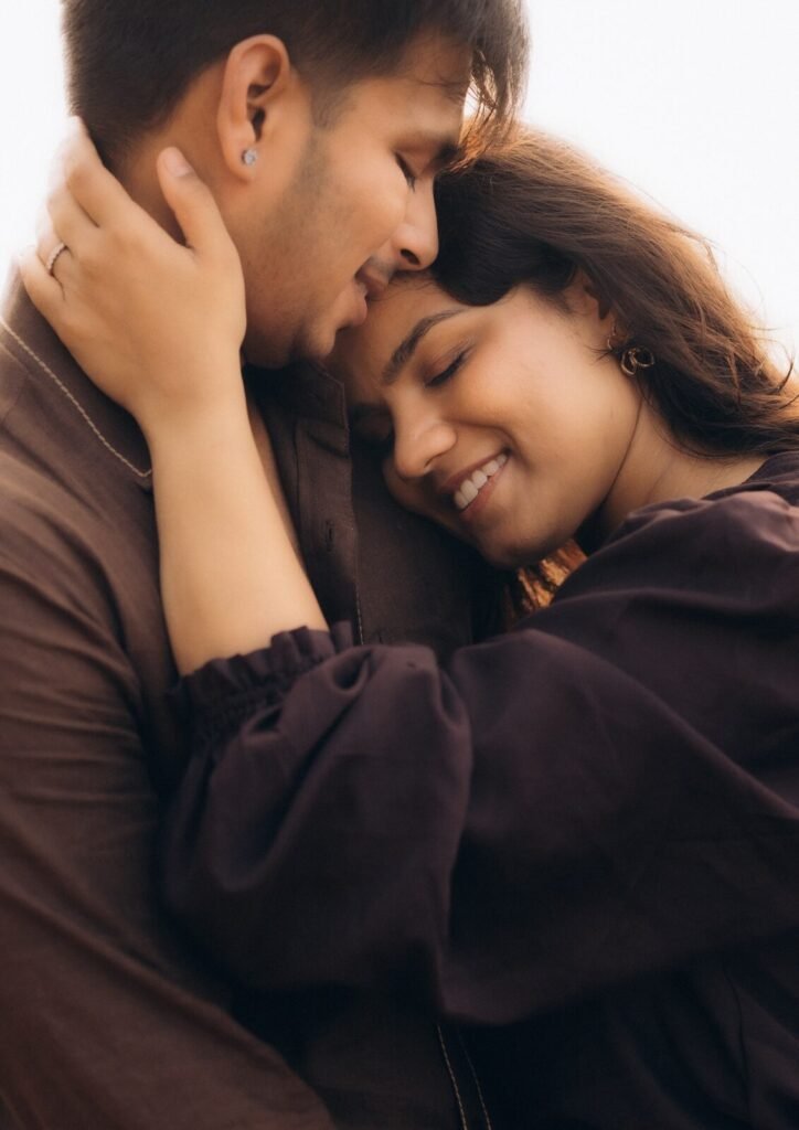 Goa pre-wedding couple embracing in golden hour light by Pavan Soni